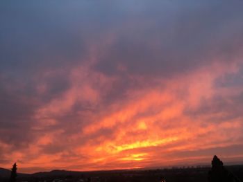 Low angle view of dramatic sky during sunset