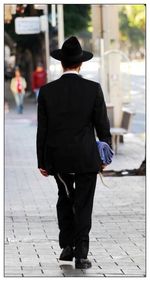 Rear view of woman standing in park