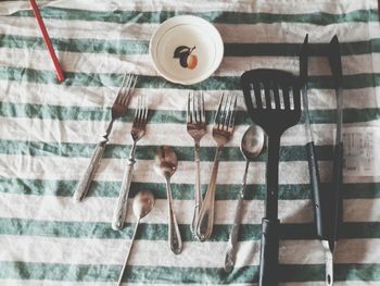High angle view of various eating utensils on table