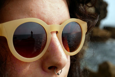 Close-up of sunglasses against blurred background