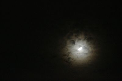 Low angle view of moon in sky at night