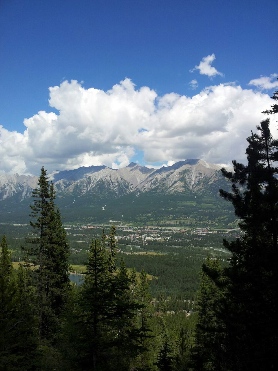 mountain, tranquil scene, scenics, tranquility, mountain range, sky, beauty in nature, tree, landscape, nature, cloud - sky, cloud, blue, non-urban scene, idyllic, lake, day, outdoors, water, non urban scene