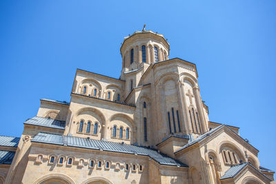 Low angle view of building against blue sky