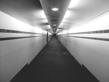 Empty illuminated subway station