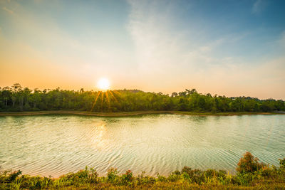 Scenic view of lake against sky during sunset