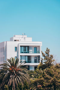 Low angle view of building against clear blue sky