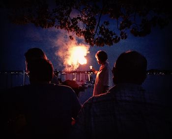 Rear view of silhouette people at night