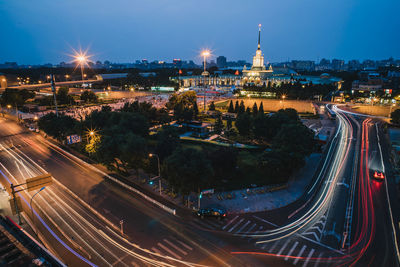 High angle view of light trails on city street at night