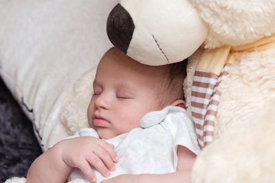 Cute baby sleeping in bed