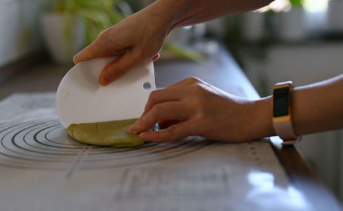 Cropped hand of man preparing food