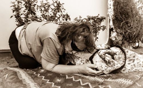 Woman lying down on bed