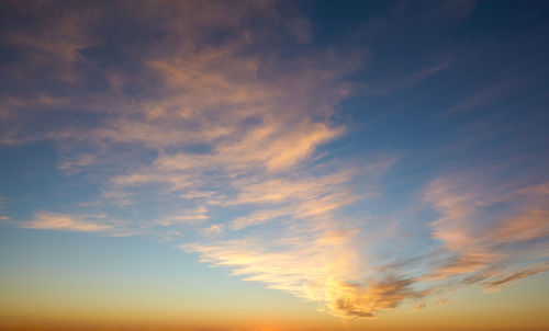 Low angle view of dramatic sky during sunset