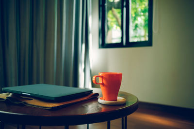 Close-up of tea cup on table at home