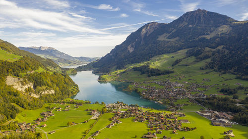 Scenic view of lake and mountains against sky