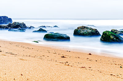 Scenic view of beach against sky