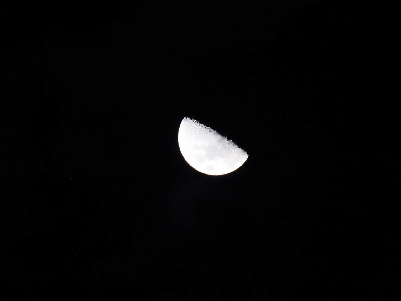 LOW ANGLE VIEW OF HALF MOON AGAINST SKY AT NIGHT