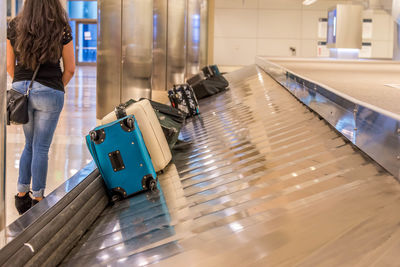 Rear view of woman at airport