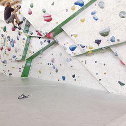 Man climbing wall at training class