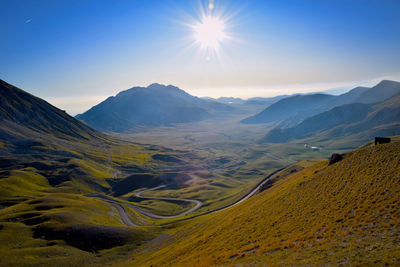 Scenic view of mountains against sky during sunset