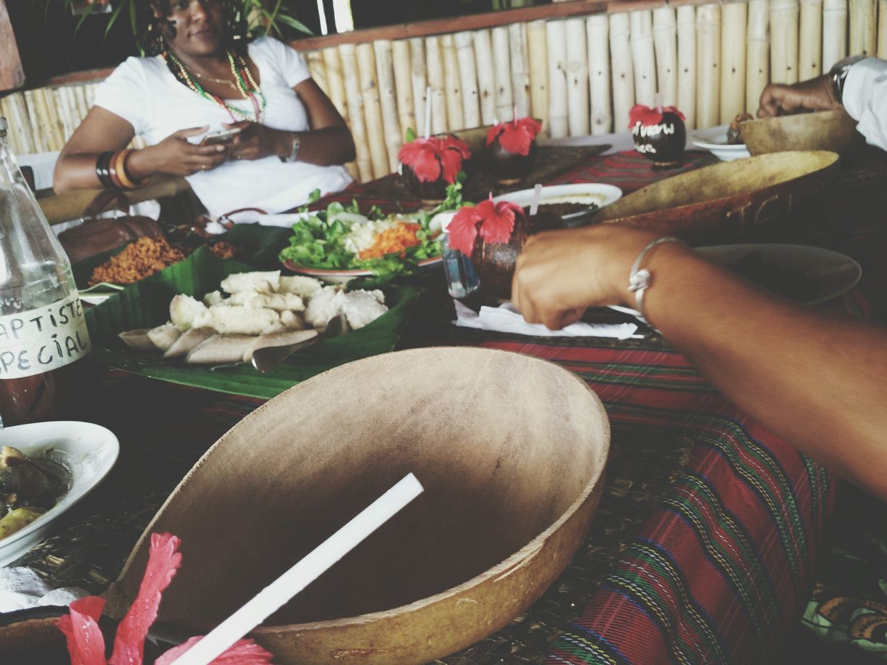 indoors, person, high angle view, food and drink, food, men, large group of objects, sitting, table, holding, part of, variation, lifestyles, working, cropped, retail