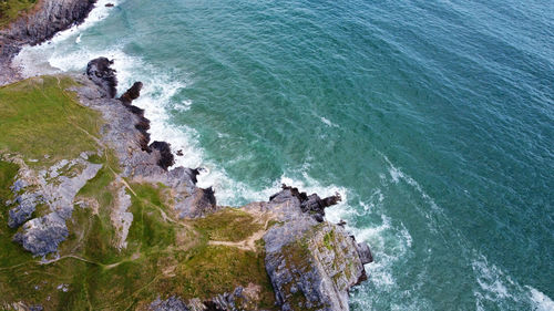 High angle view of rocks in sea