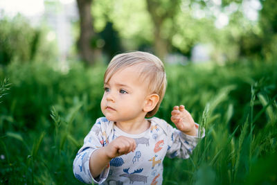 Portrait of cute baby boy outdoors