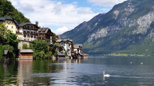 Scenic view of lake and mountains against sky