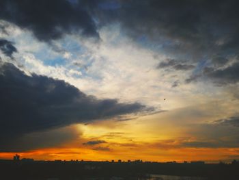 Low angle view of silhouette landscape against sky during sunset