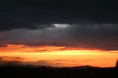 Scenic view of dramatic sky during sunset