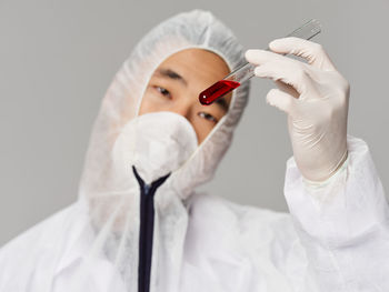 Close-up of dentist holding dentures