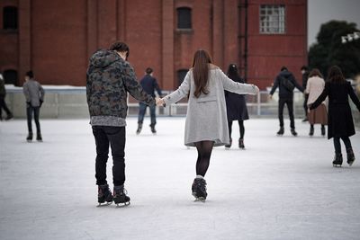 Group of people on snow in city