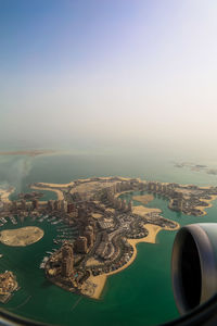 Aerial view of cityscape against sky