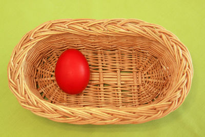 High angle view of red eggs in basket