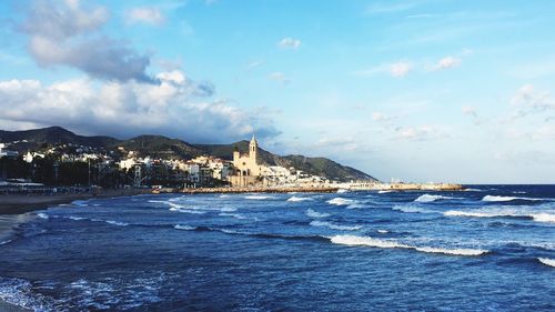 Scenic view of sea against cloudy sky