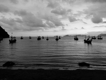 Scenic view of sea against cloudy sky