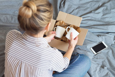 High angle view of woman using mobile phone