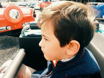 Close-up of boy sitting in car