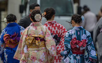 Full frame view of women in traditional kimonos walking away