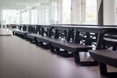 Empty chairs and tables in restaurant