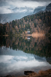 Cabin in the woods at mountain lake reedsee in the austrian alps in gastein in  moody fall colors