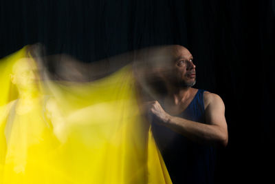 Time lapse view of woman moving a rag. long exposure, motion blur. 