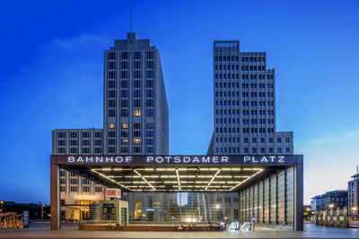 Illuminated potsdamer platz against sky at dusk