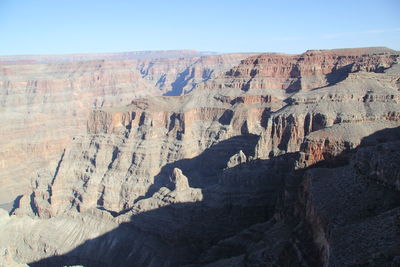 Scenic view of rocky mountains against clear blue sky at grand canyon national park