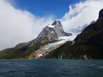 Scenic view of mountains and sea against sky in a fjord of the chilean patagonia