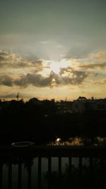 Silhouette trees against sky during sunset