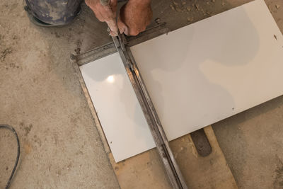 Low section of carpenter working at construction site