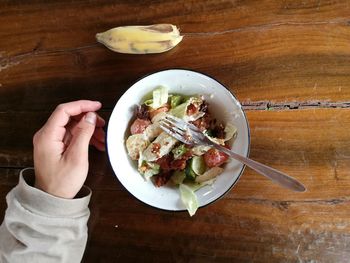 Directly above shot of person preparing food on table