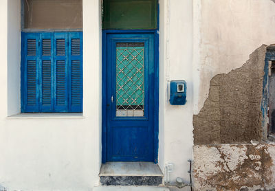 Closed blue door of building