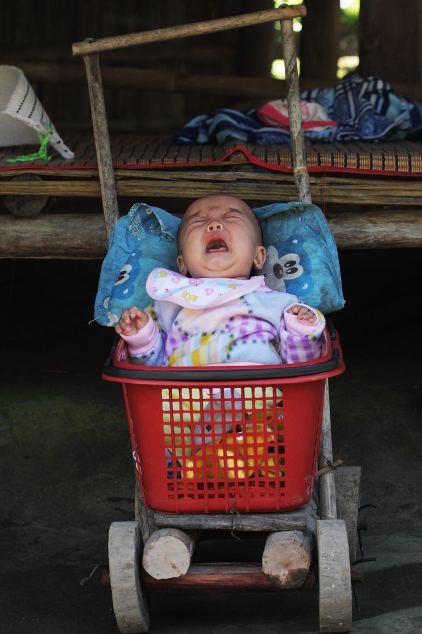 PORTRAIT OF BABY BOY IN SHOP