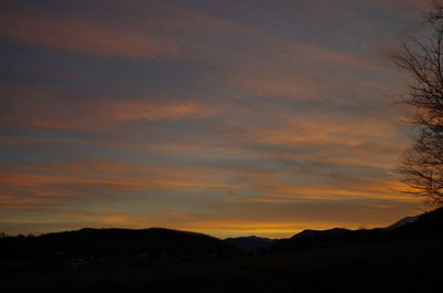 Scenic view of silhouette mountains against sky during sunset